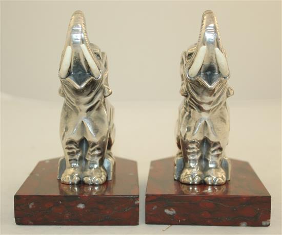 A pair of French Art Deco silvered metal and red marble elephant bookends, 5.5in.